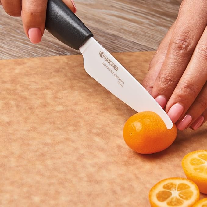 Kyocera’s Revolution 4-Piece Ceramic Knife Set: Ceramic Chef Knife For Your Cooking Needs, 7" Chef's Santoku, 5.5" Santoku, 4.5" Utility & 3" Paring Knives, Black/White